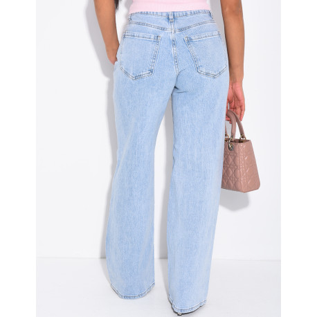 Jeans with frayed seams and studs on the pockets