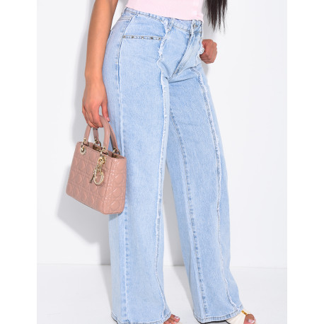 Jeans with frayed seams and studs on the pockets