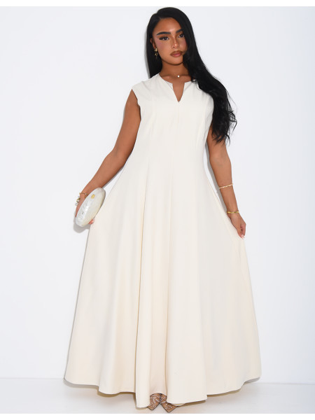 Ensemble robe sans manche évasée et cape plissée à broche