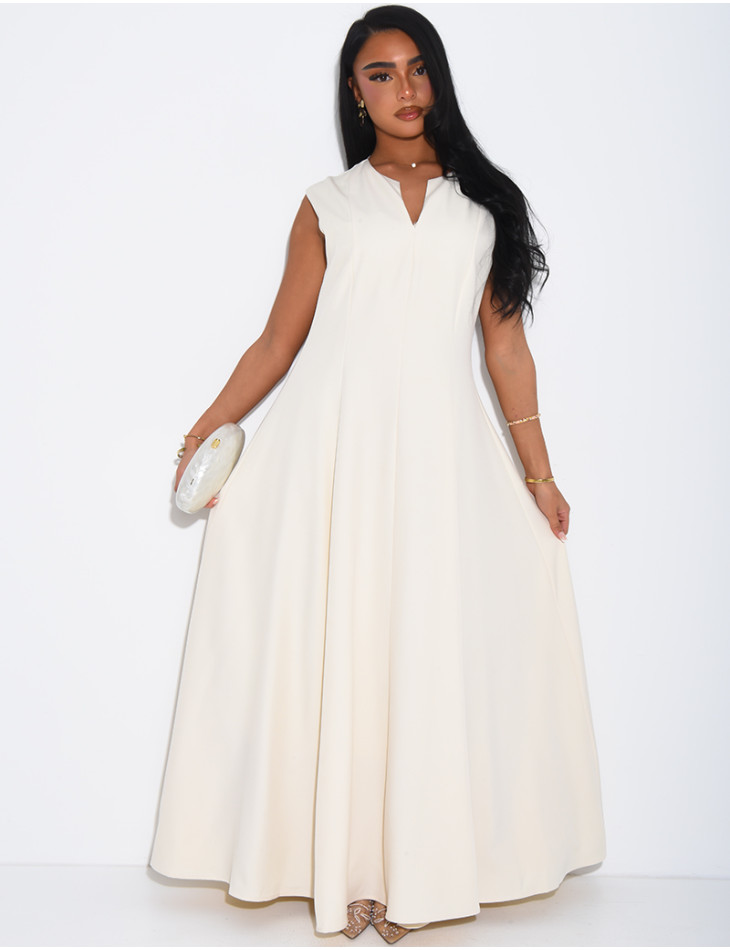 Ensemble robe sans manche évasée et cape plissée à broche
