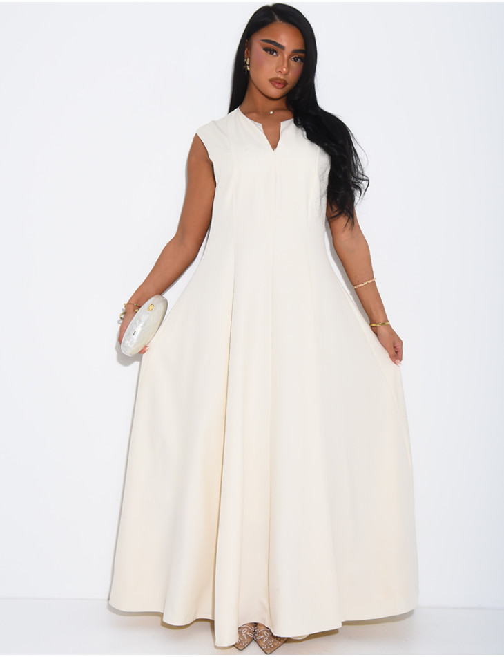 Ensemble robe sans manche évasée et cape plissée à broche