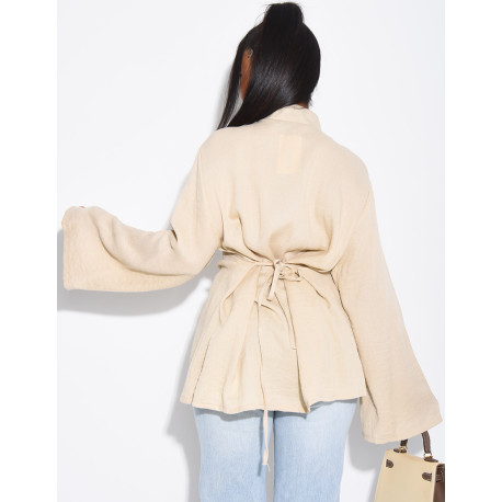 High-neck blouse with ties that fasten at the back