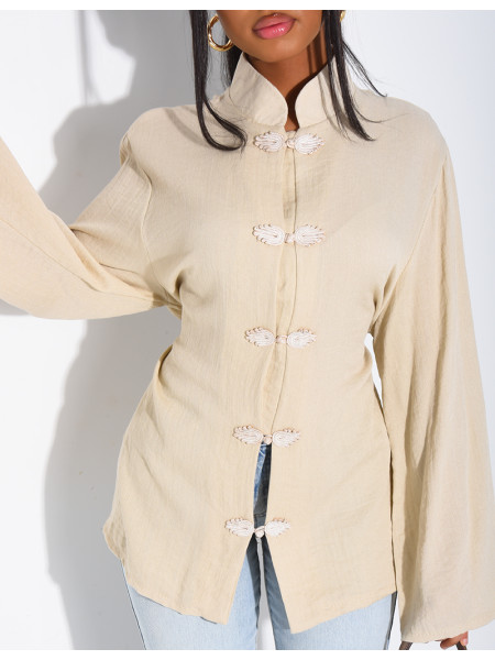 High-neck blouse with ties that fasten at the back
