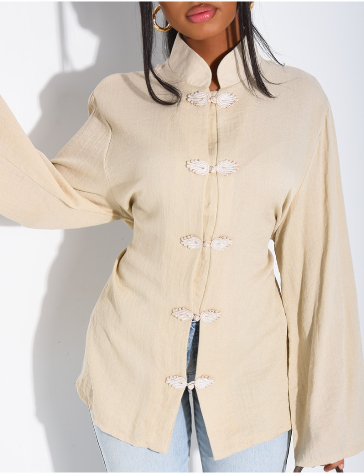 High-neck blouse with ties that fasten at the back