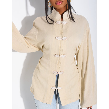 High-neck blouse with ties that fasten at the back