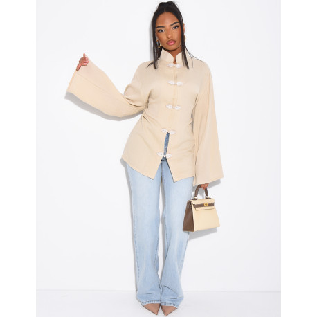 High-neck blouse with ties that fasten at the back