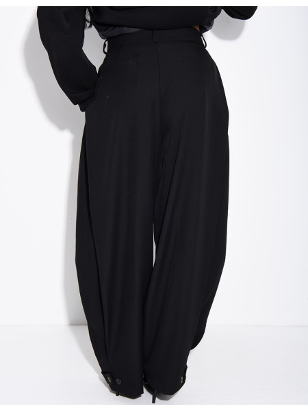 Flared tailored pants with buttons at the ankles