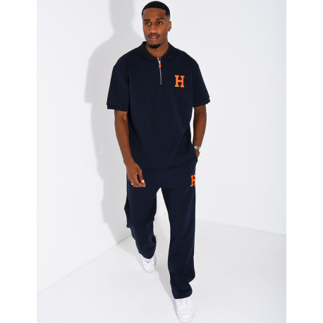 Set aus Hose und Polohemd mit dem Buchstaben H