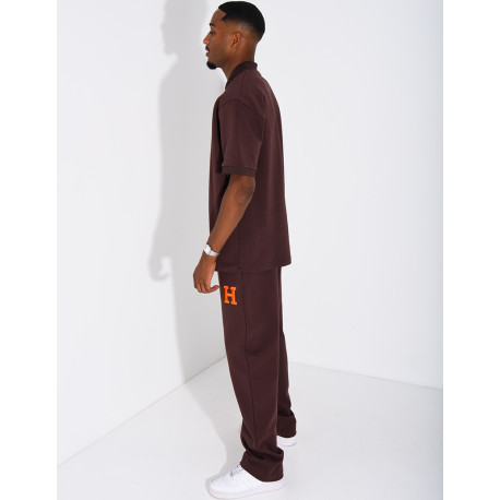 Set aus Hose und Polohemd mit dem Buchstaben H