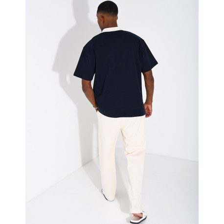 Zweifarbiges Set aus Hose und Polohemd mit Kleeblatt-Motiv