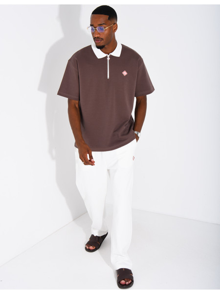 Two-tone set comprising trousers and a polo shirt with a clover logo