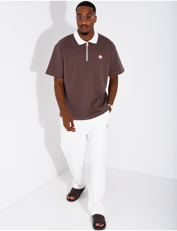 Two-tone set comprising trousers and a polo shirt with a clover logo