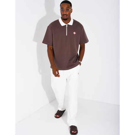 Two-tone set comprising trousers and a polo shirt with a clover logo