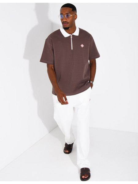 Two-tone set comprising trousers and a polo shirt with a clover logo