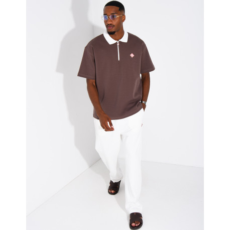 Two-tone set comprising trousers and a polo shirt with a clover logo