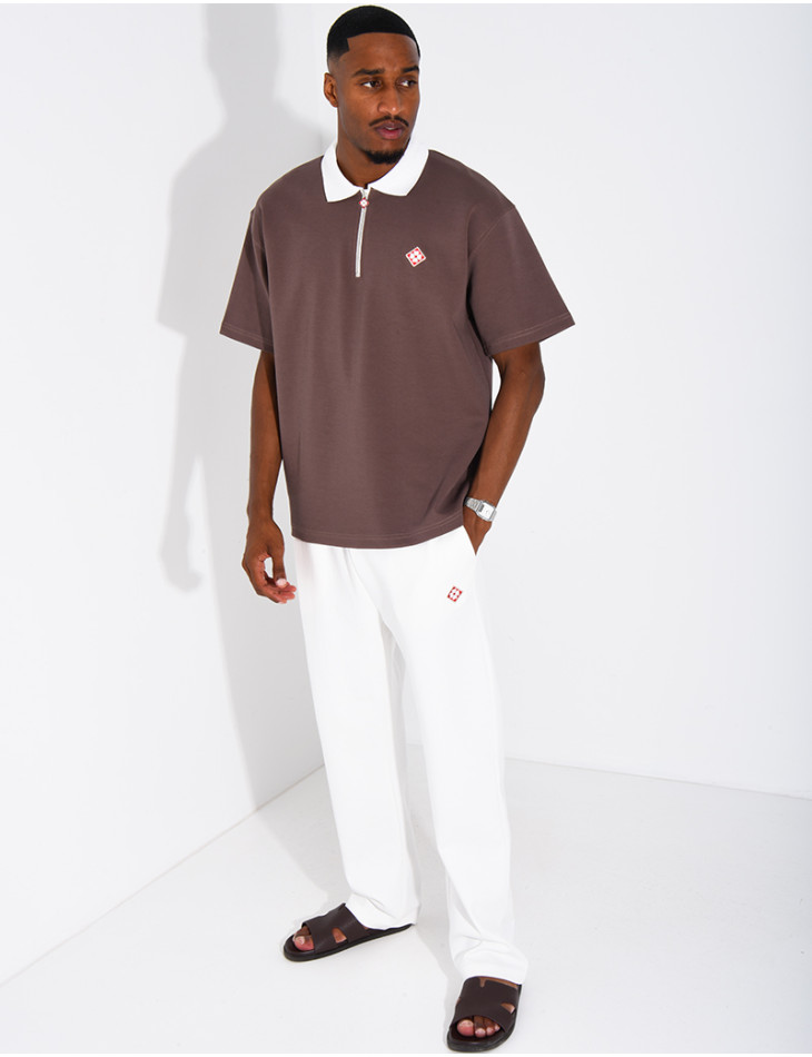 Two-tone set comprising trousers and a polo shirt with a clover logo