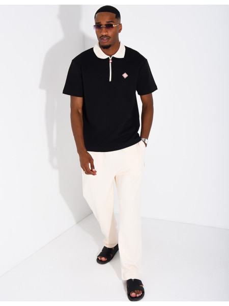Two-tone set comprising trousers and a polo shirt with a clover logo