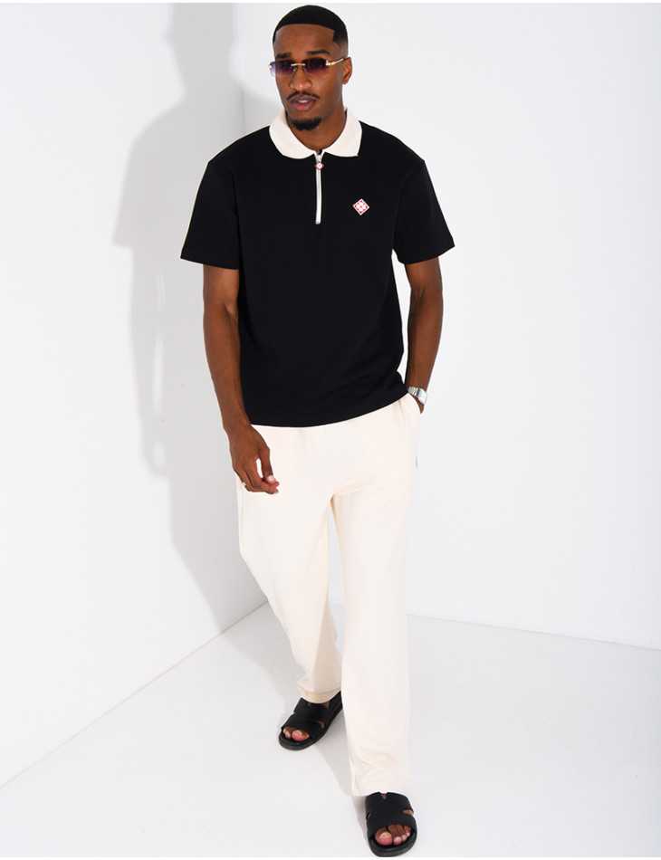Two-tone set comprising trousers and a polo shirt with a clover logo