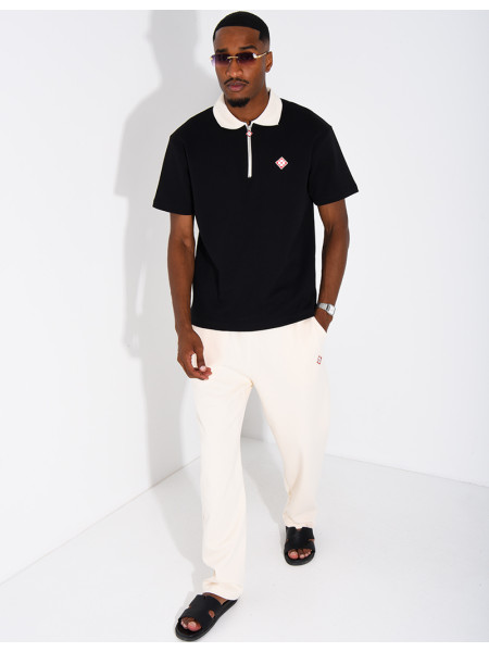 Two-tone set comprising trousers and a polo shirt with a clover logo
