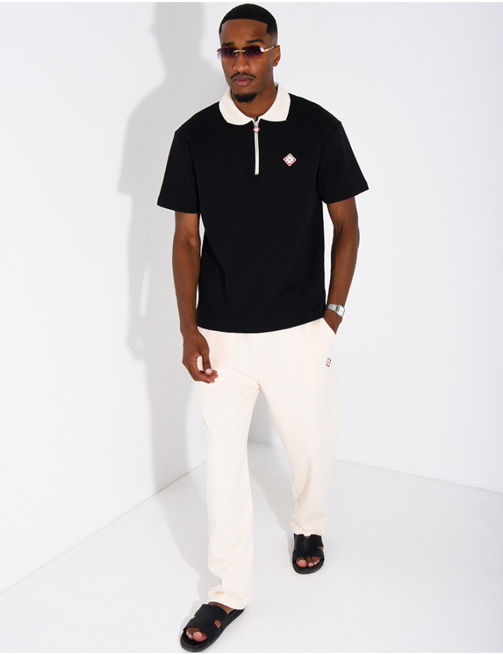 Two-tone set comprising trousers and a polo shirt with a clover logo