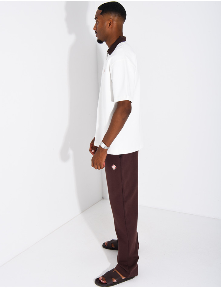 Two-tone set comprising trousers and a polo shirt with a clover logo