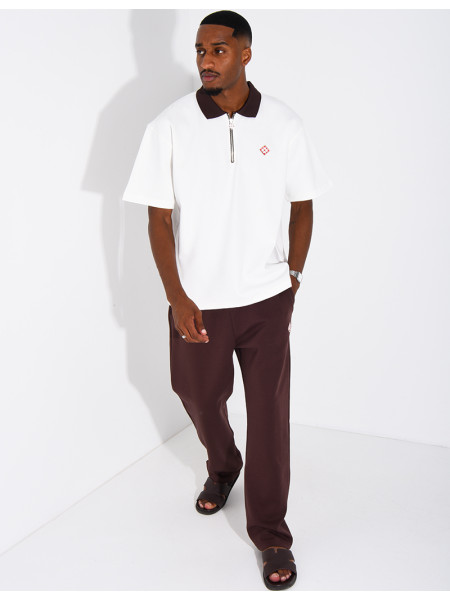 Two-tone set comprising trousers and a polo shirt with a clover logo