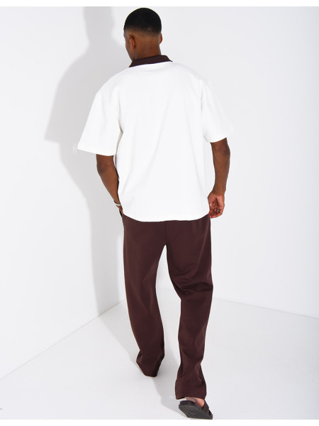 Two-tone set comprising trousers and a polo shirt with a clover logo
