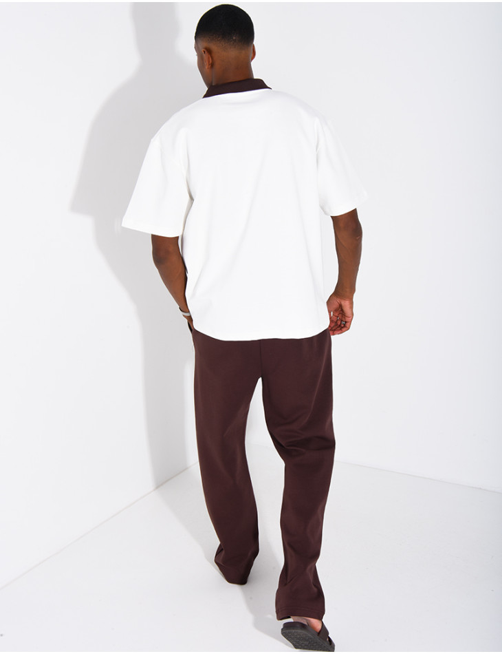 Two-tone set comprising trousers and a polo shirt with a clover logo