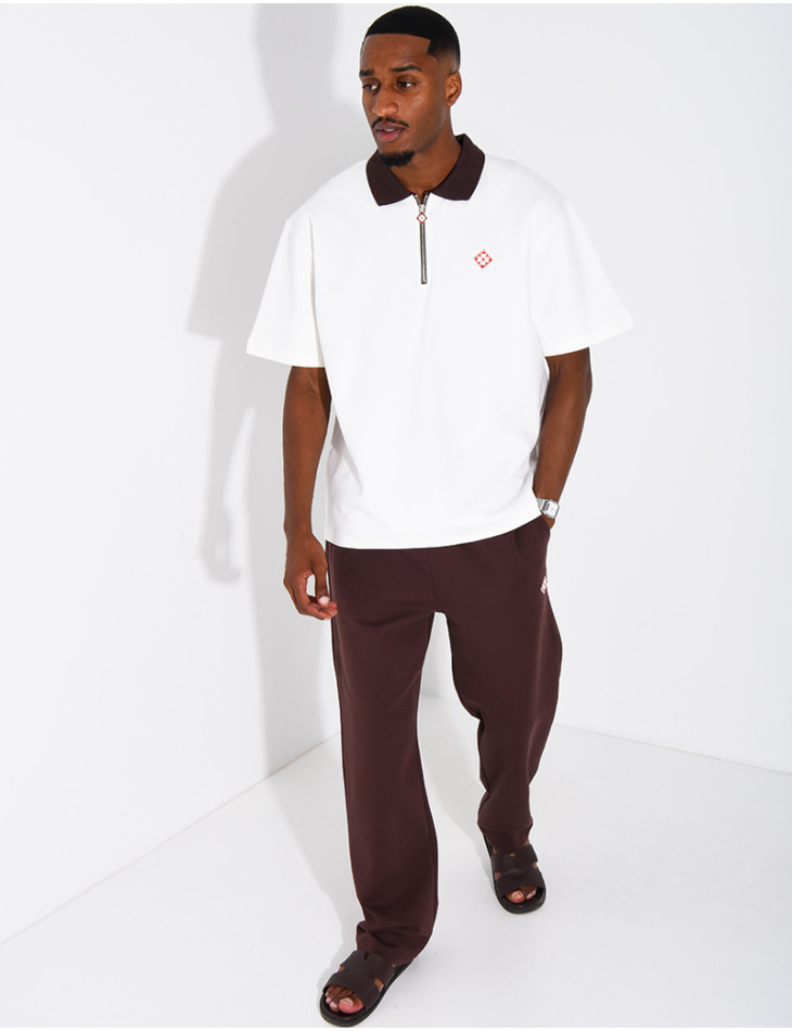 Two-tone set comprising trousers and a polo shirt with a clover logo