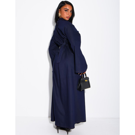 Long denim dress with a high neckline and a tie-back detail