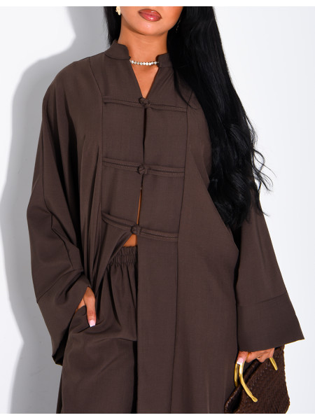 Set comprising trousers and a long tunic with Asian-style fastenings