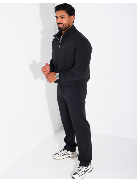 Set featuring a zippered jacket and straight-leg pants made of waterproof fabric