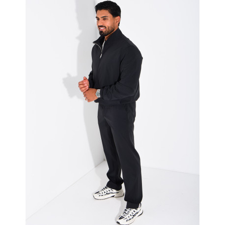 Set featuring a zippered jacket and straight-leg pants made of waterproof fabric