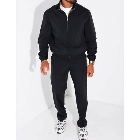 Set featuring a zippered jacket and straight-leg pants made of waterproof fabric