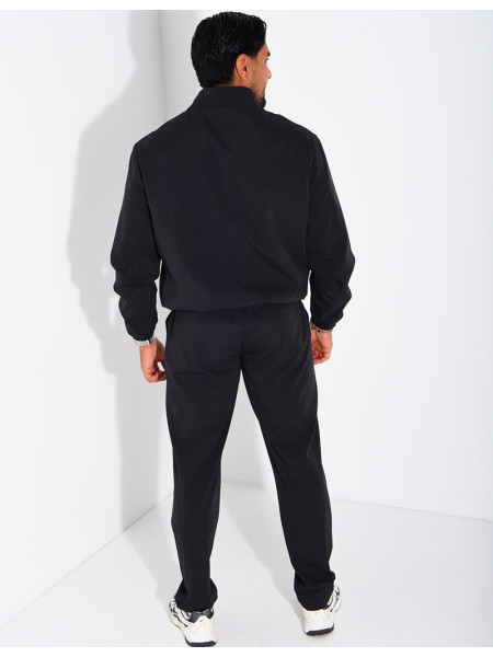 Set featuring a zippered jacket and straight-leg pants made of waterproof fabric