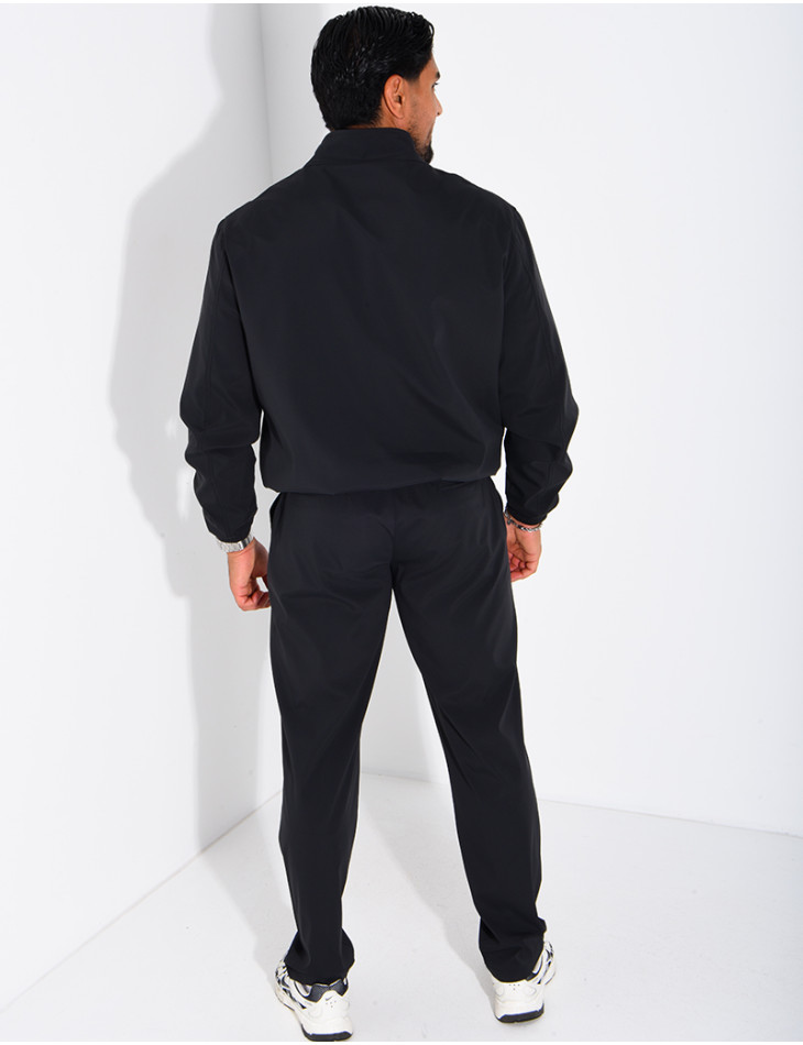 Set featuring a zippered jacket and straight-leg pants made of waterproof fabric