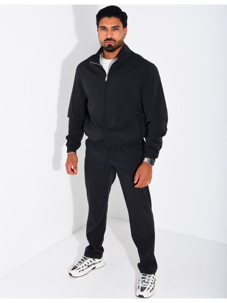 Set featuring a zippered jacket and straight-leg pants made of waterproof fabric