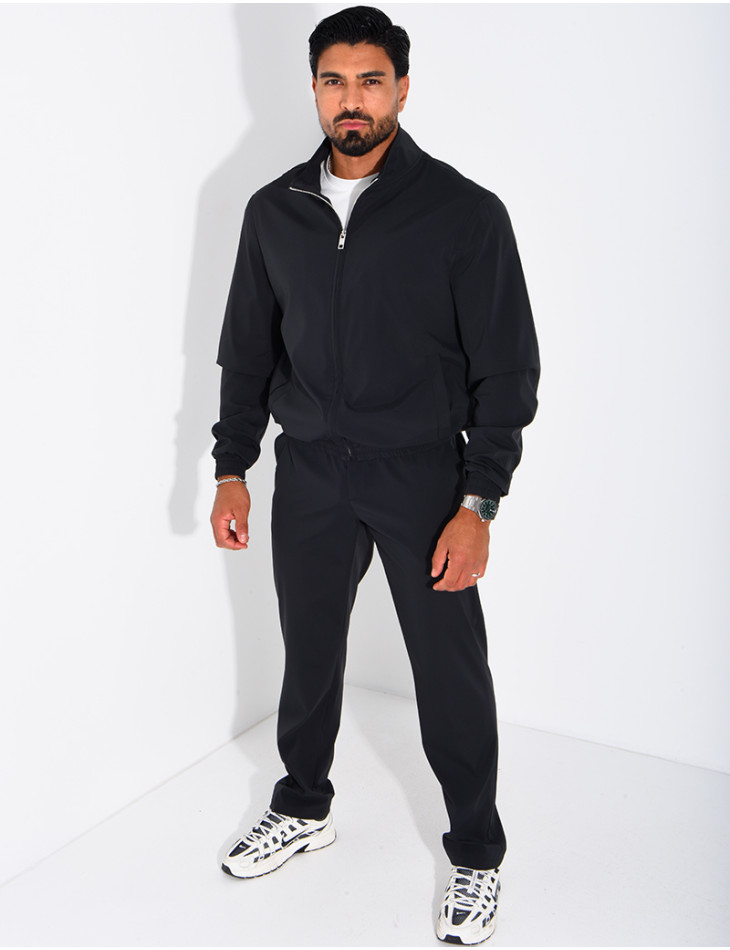 Set featuring a zippered jacket and straight-leg pants made of waterproof fabric
