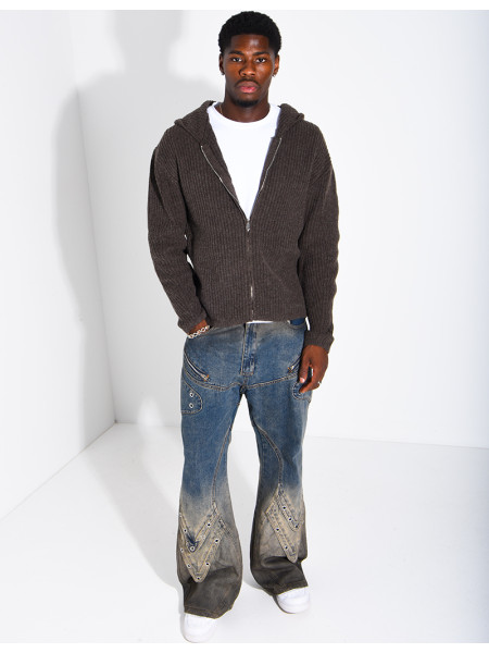 Jeans effet délavé à empiècements et oeillets