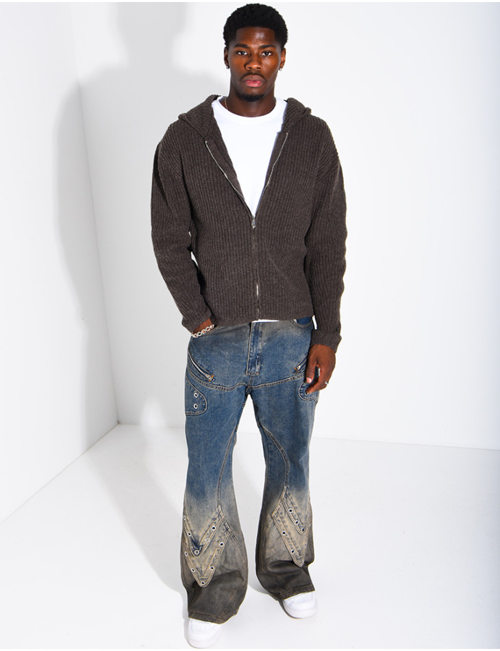 Jeans effet délavé à empiècements et oeillets
