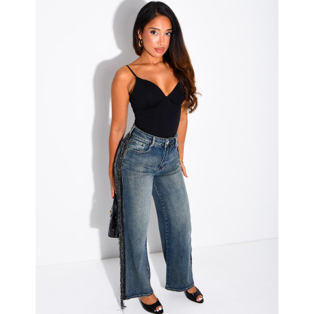 Faded wide-leg jeans with sequinned fringing down the sides