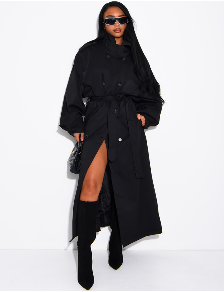 Long, oversized trench coat with a stand-up collar and a belt at the waist