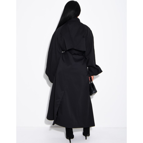 Long, oversized trench coat with a stand-up collar and a belt at the waist