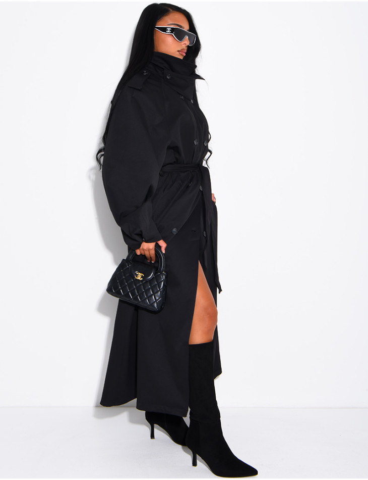 Long, oversized trench coat with a stand-up collar and a belt at the waist