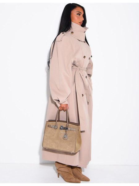 Long, oversized trench coat with a stand-up collar and a belt at the waist