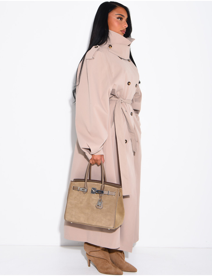 Long, oversized trench coat with a stand-up collar and a belt at the waist