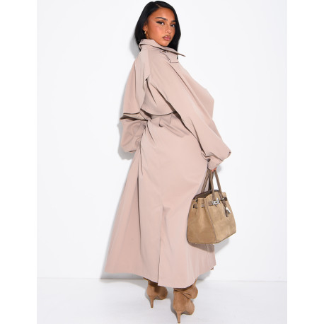 Long, oversized trench coat with a stand-up collar and a belt at the waist
