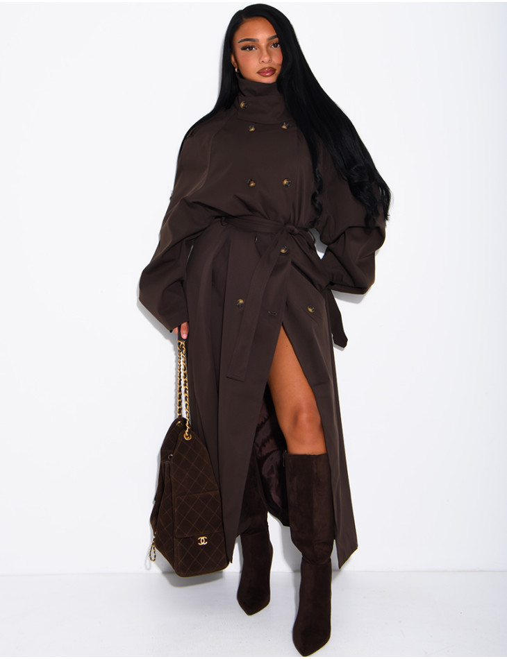 Long, oversized trench coat with a stand-up collar and a belt at the waist