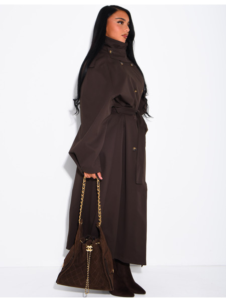 Long, oversized trench coat with a stand-up collar and a belt at the waist