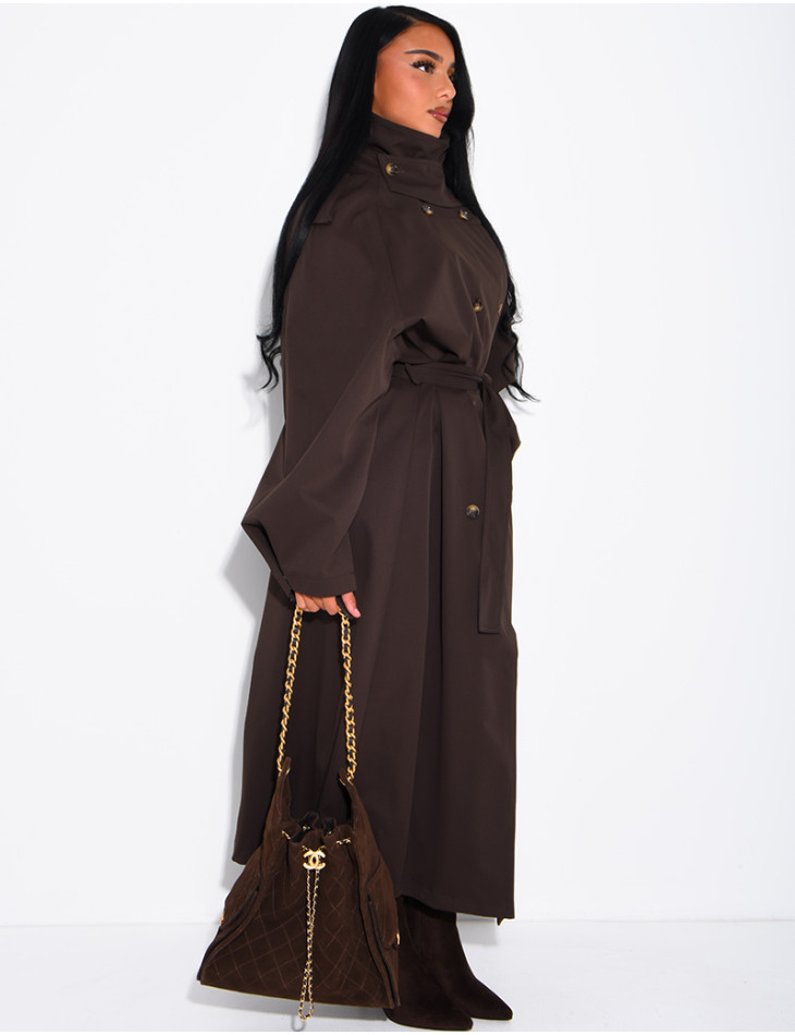 Long, oversized trench coat with a stand-up collar and a belt at the waist